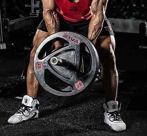 muscular man lifting weight